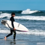 Surfer entering the ocean